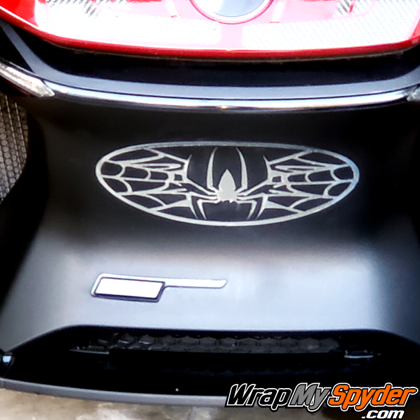 chrome-oval web-spider emblem