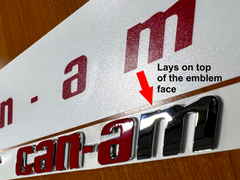 Can-am Spyder F3 vinyl colored text overlays on top of the emblem face